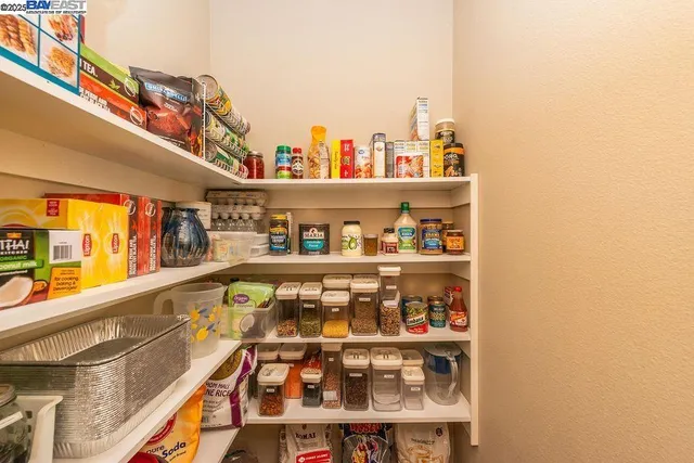 a spacious bathroom with a double vanity sink and a mirror