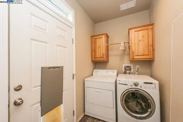 a spacious bathroom with a double vanity sink and a bathtub