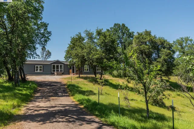 a view of a lake with a house in the background
