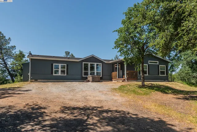 a view of a lake with houses in the background