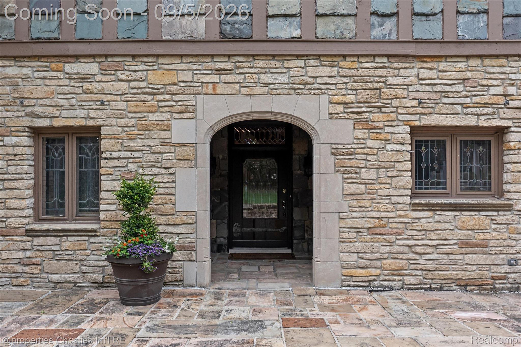 1540 Mill Race Road Rochester, MI 48306 - Photo 10 of 99 Stone facade with an arched entry and leaded glass windows