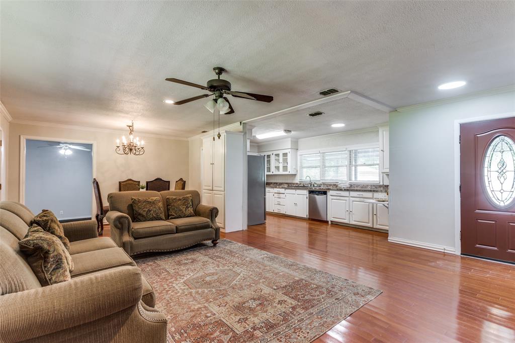 227 North 9th Street Jacksboro, TX 76458 - Photo 4 of 14 a living room with furniture and a wooden floor