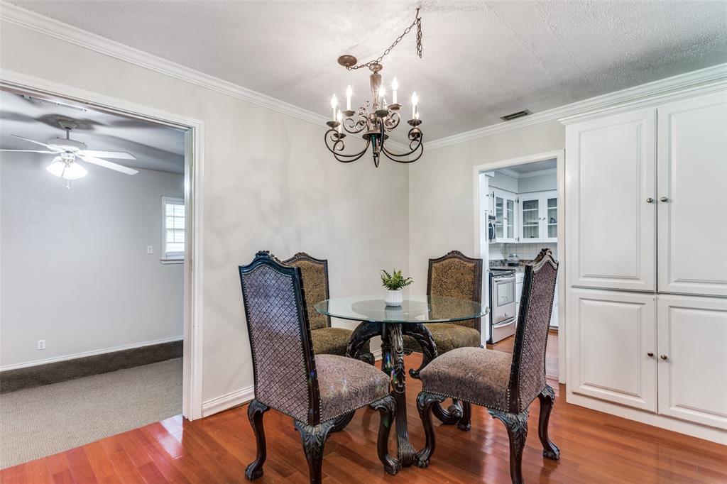 227 North 9th Street Jacksboro, TX 76458 - Photo 5 of 14 a view of a dining room with furniture and wooden floor