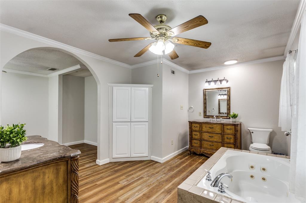 227 North 9th Street Jacksboro, TX 76458 - Photo 10 of 14 a bath room with a sink and a mirror