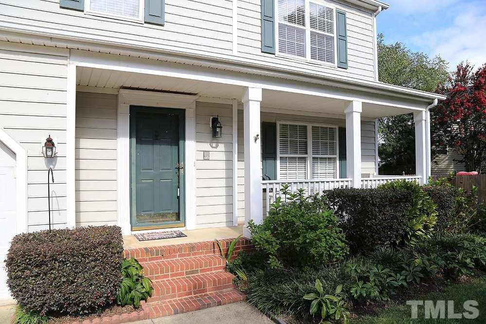 8313 Trumpetor Way Raleigh, NC 27613 - Photo 2 of 21 a front view of a house with a yard