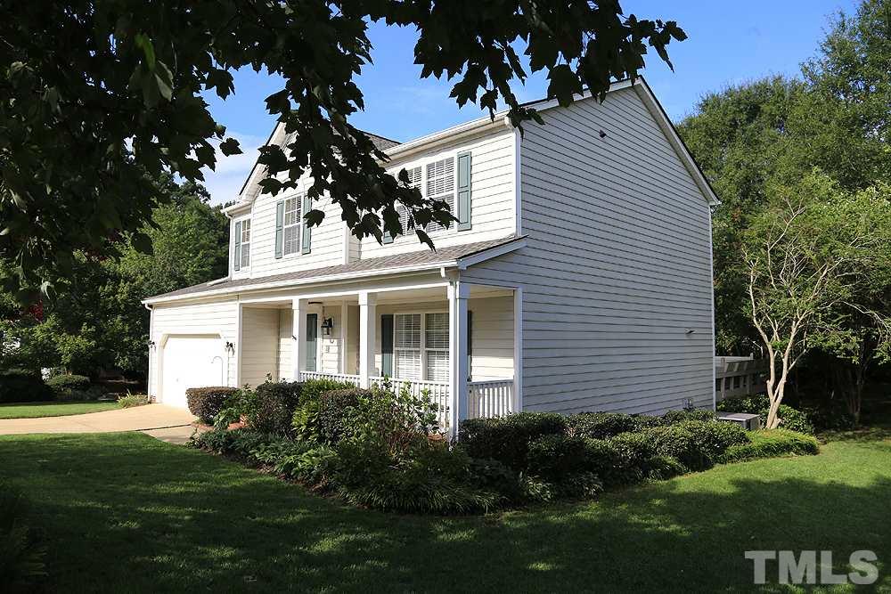 8313 Trumpetor Way Raleigh, NC 27613 - Photo 3 of 21 a front view of a house with a garden
