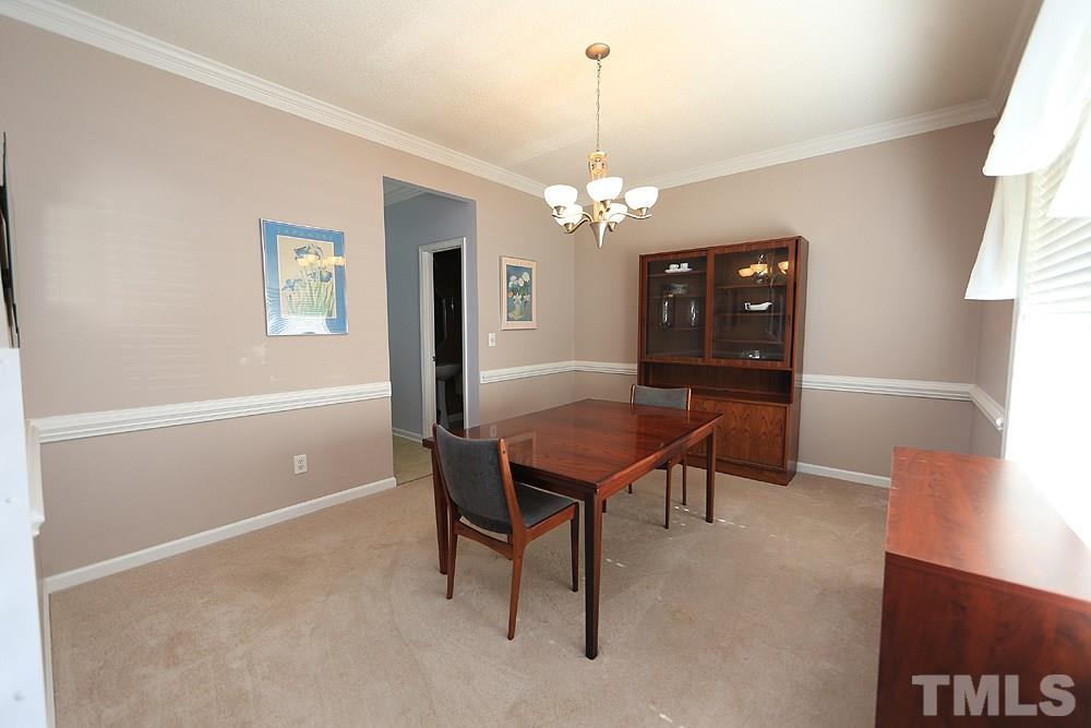 8313 Trumpetor Way Raleigh, NC 27613 - Photo 5 of 21 a view of a livingroom with furniture and window