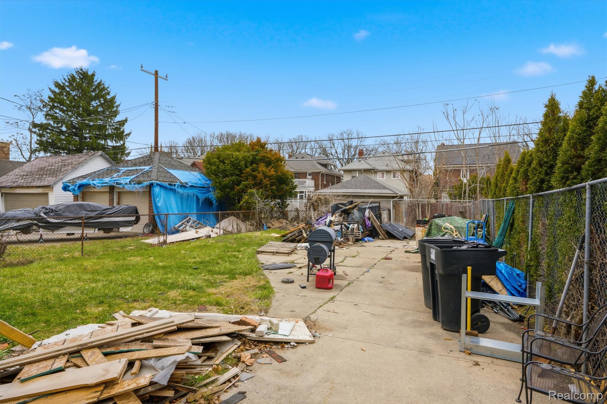 2500 Atkinson Street Detroit, MI 48206 - Photo 21 of 21 Fenced backyard with a patio area and a residential view