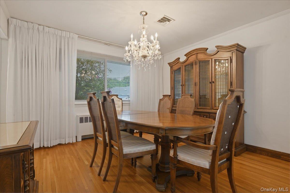 17 Avon Road Farmingdale, NY 11735 - Photo 7 of 46 a view of a dining room with furniture window and wooden floor