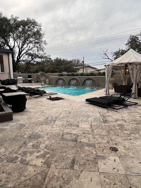 7734 Meadow Road, Unit 117 Dallas, TX 75230 - Photo 14 of 15 View of pool featuring a patio area and a gazebo
