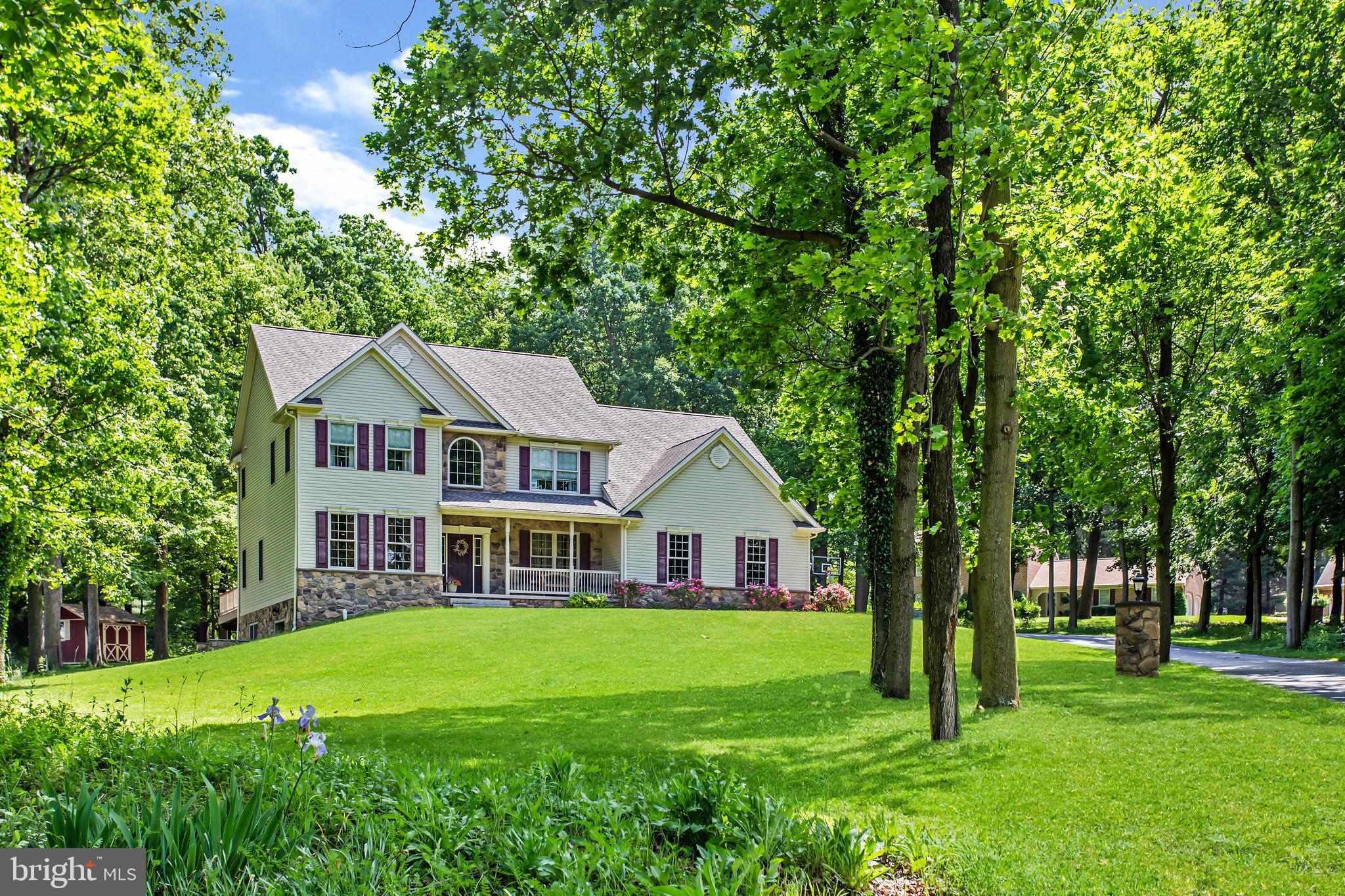 216 Blooming Grove Road Hanover, PA 17331 - Photo 2 of 60 a front view of a house with garden