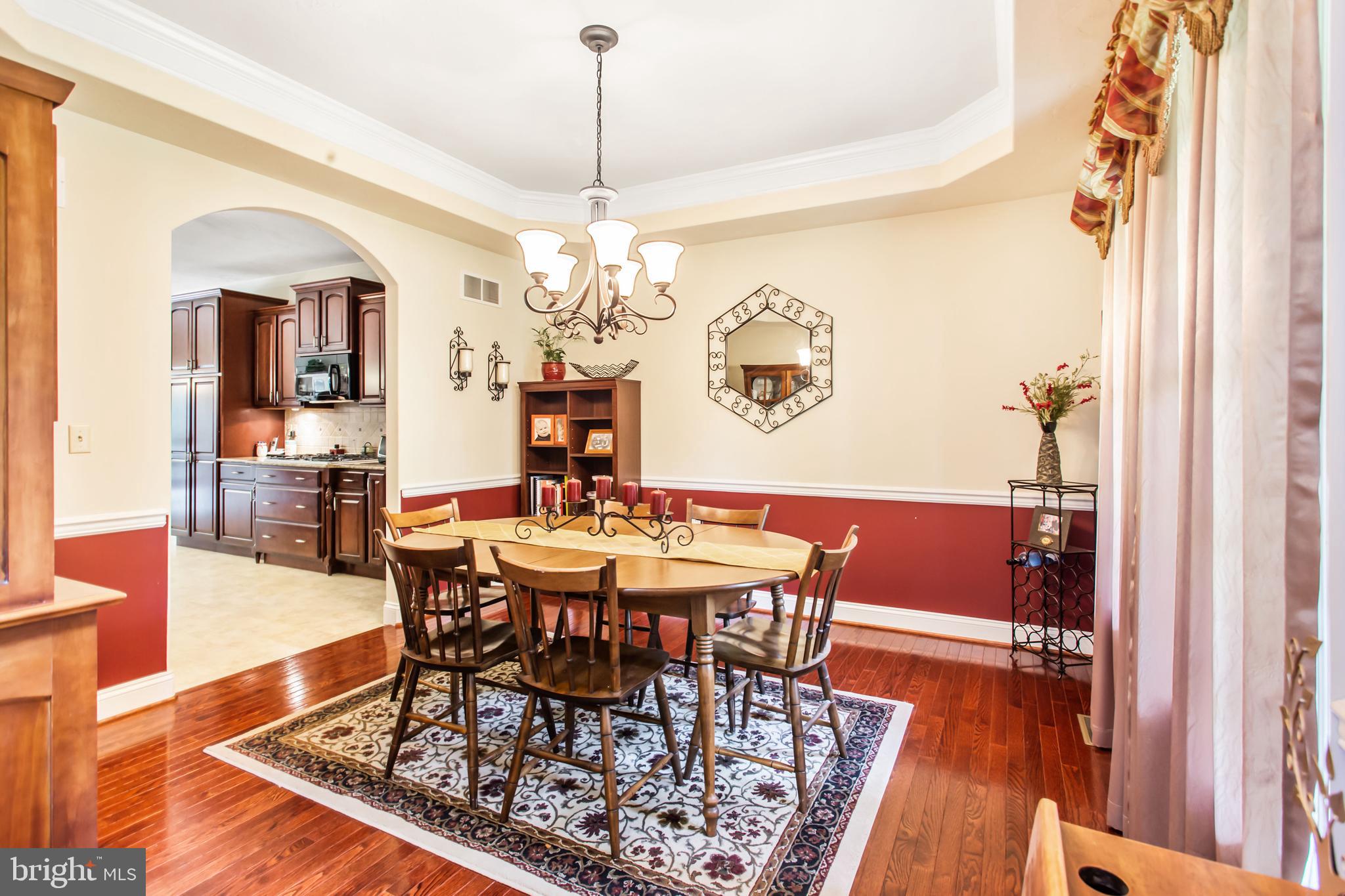 216 Blooming Grove Road Hanover, PA 17331 - Photo 17 of 60 a view of a dining room with furniture wooden floor and chandelier