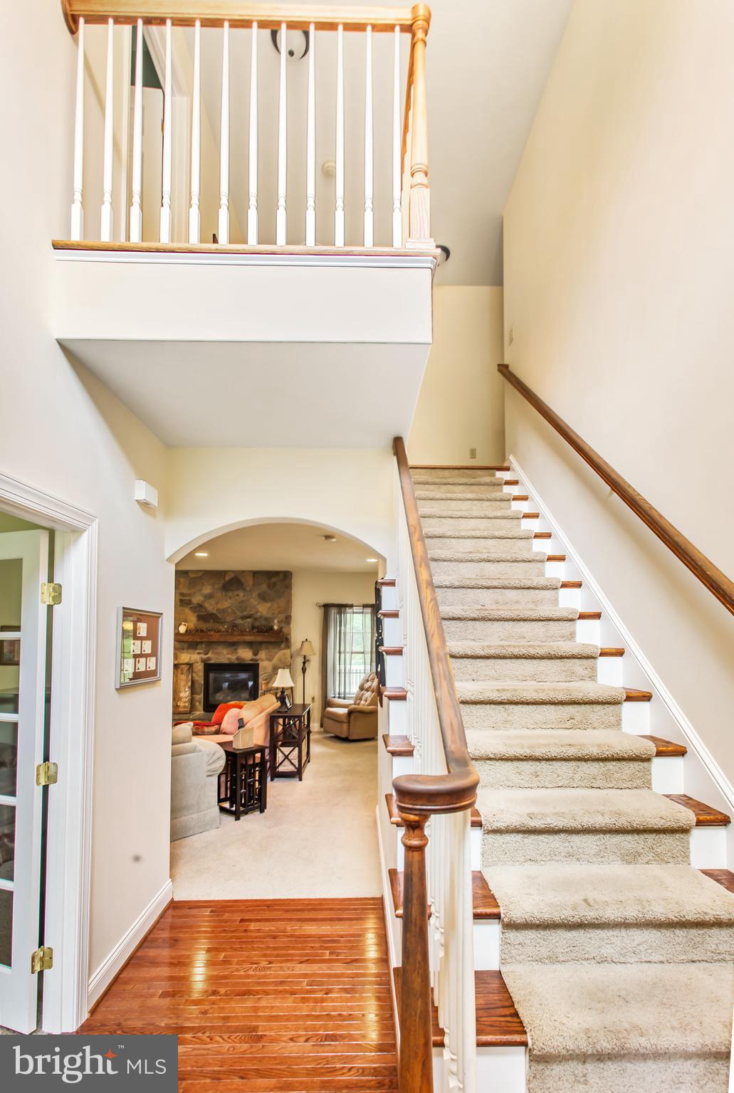 216 Blooming Grove Road Hanover, PA 17331 - Photo 19 of 60 a view of staircase with lots of frames on wall and a potted plant