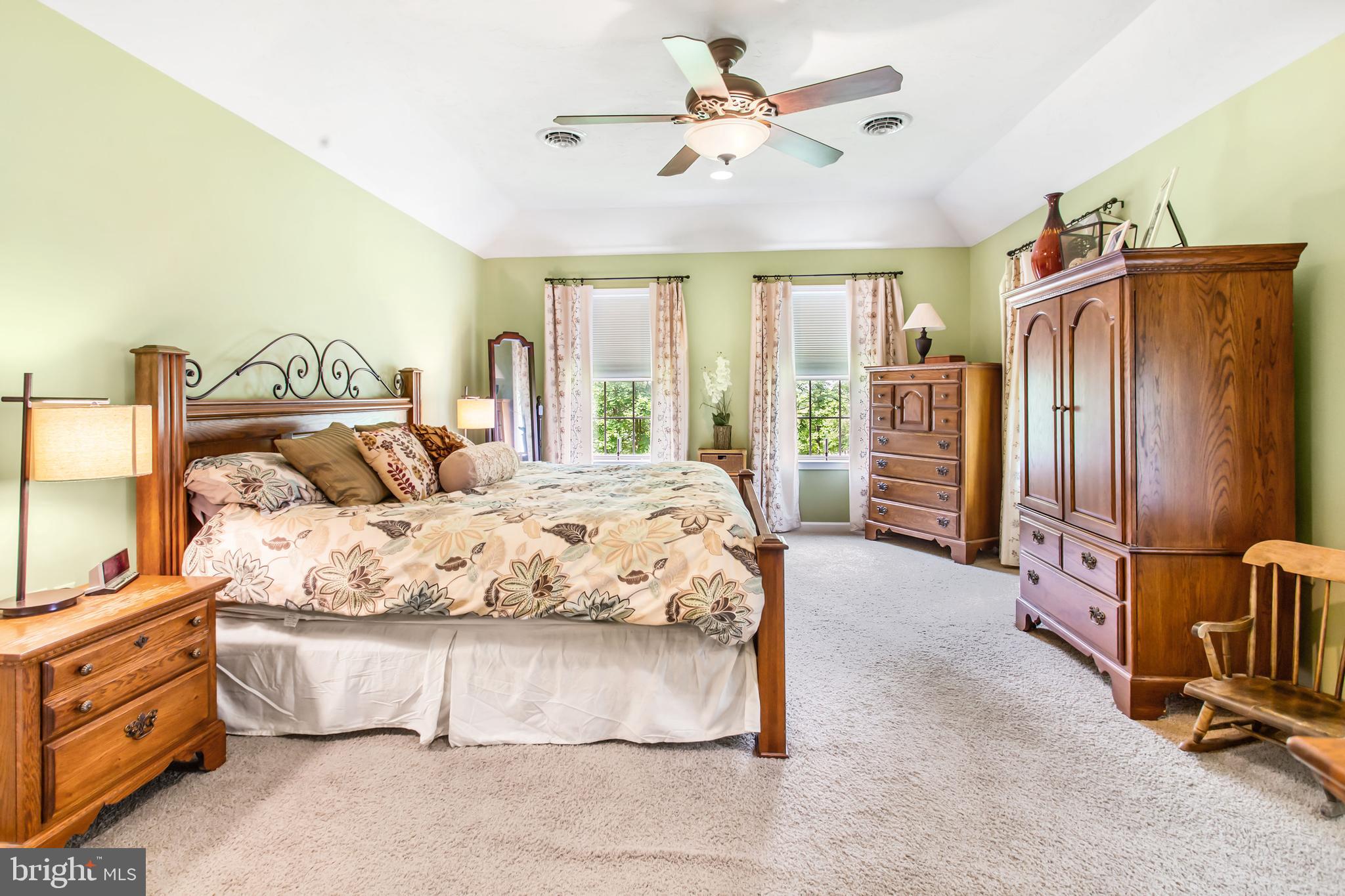 216 Blooming Grove Road Hanover, PA 17331 - Photo 36 of 60 a spacious bedroom with a bed a dresser and a chandelier