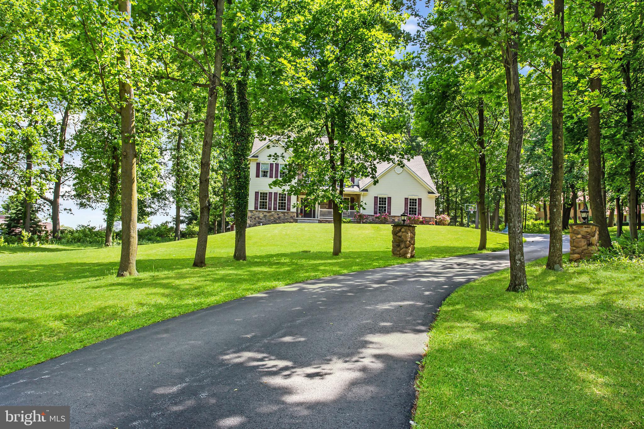 216 Blooming Grove Road Hanover, PA 17331 - Photo 6 of 60 a view of a house with a big yard and palm trees
