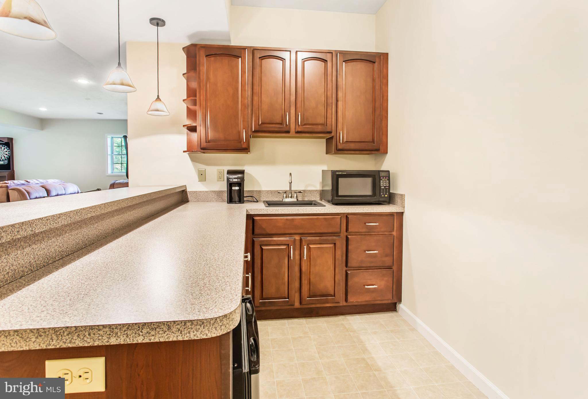 216 Blooming Grove Road Hanover, PA 17331 - Photo 53 of 60 a kitchen with stainless steel appliances granite countertop a sink a stove and a microwave