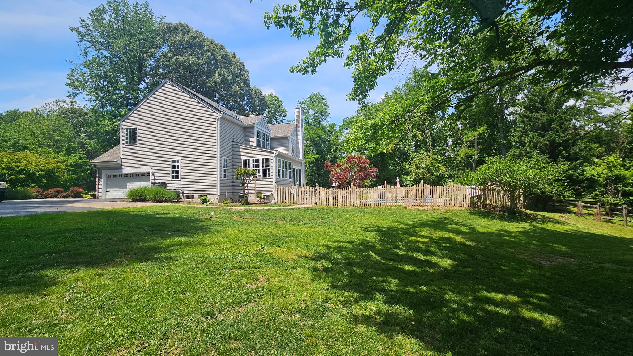 6107 Traceys Overlook Road Tracys Landing, MD 20779 - Photo 2 of 67 a view of backyard with garden and trees
