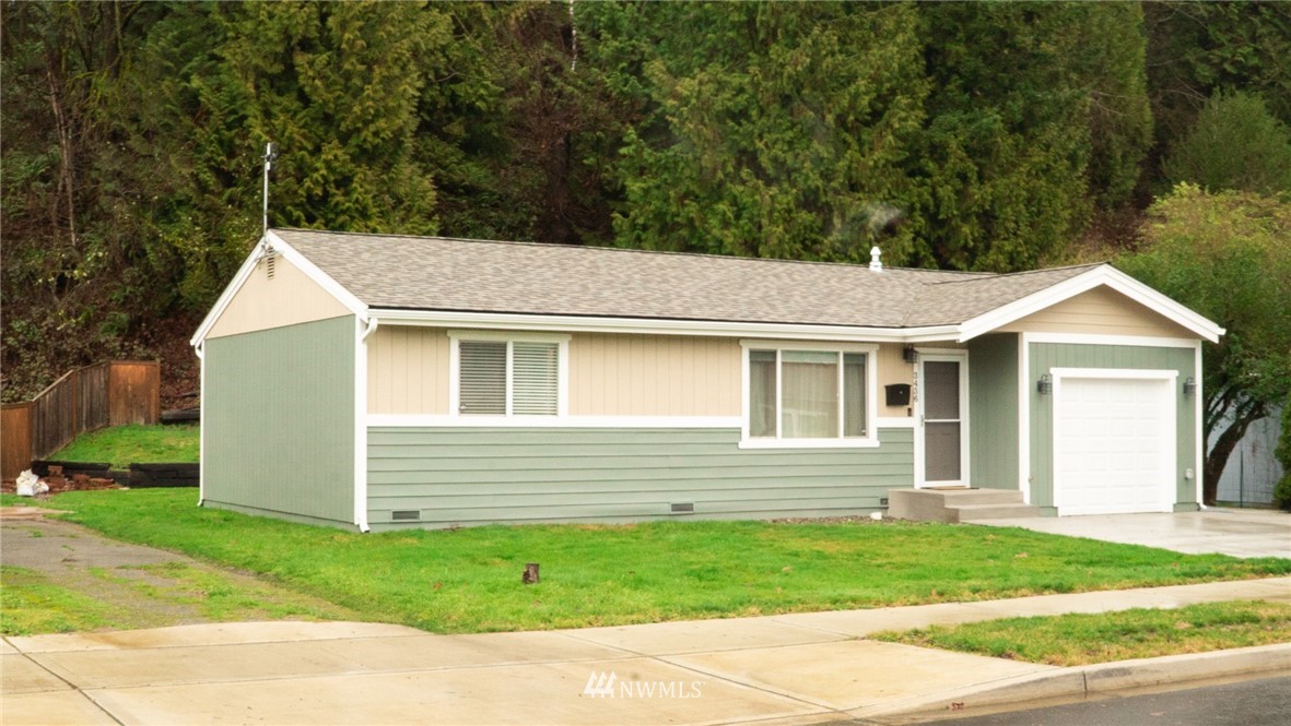 3436 Southeast 5th Street Renton, WA 98058 - Photo 1 of 28 a view of a house with a yard