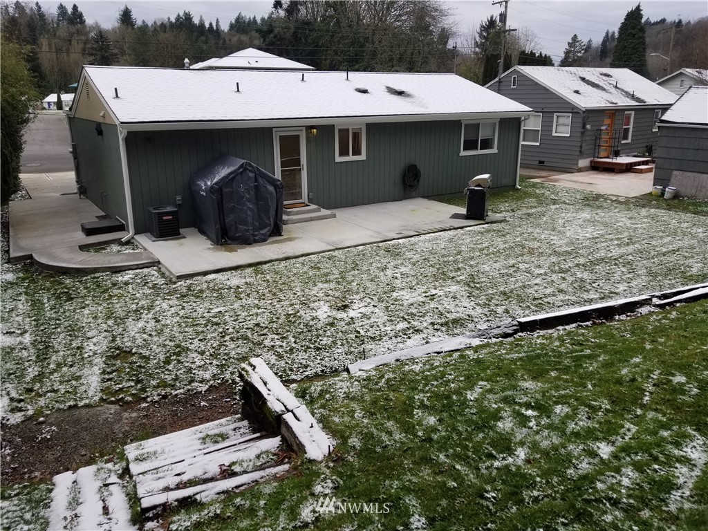 3436 Southeast 5th Street Renton, WA 98058 - Photo 24 of 28 a front view of a house with table and chairs