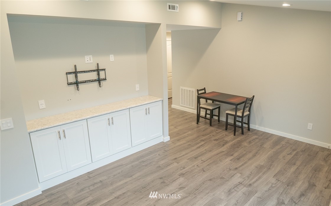 3436 Southeast 5th Street Renton, WA 98058 - Photo 4 of 28 a view of dining room with furniture and wooden floor