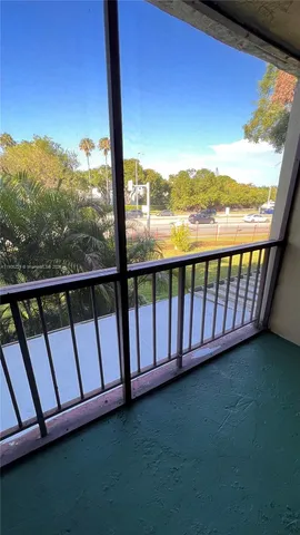 a view of roof deck with couches