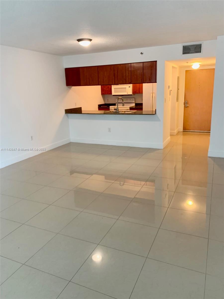 a view of a kitchen with a sink