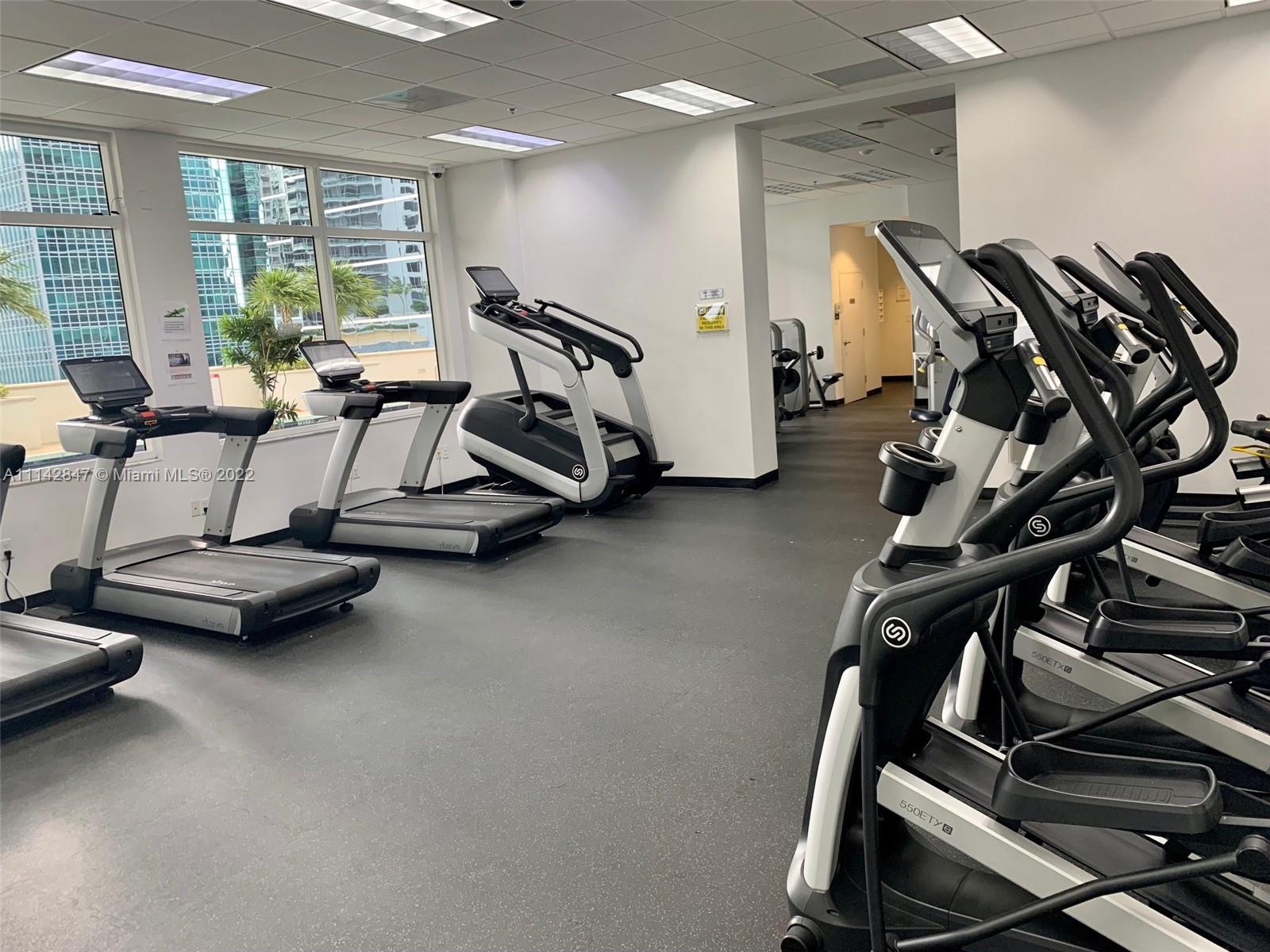 1200 Brickell Bay Drive, Unit 1812 Miami, FL 33131 - Photo 18 of 24 a view of a room with gym equipment