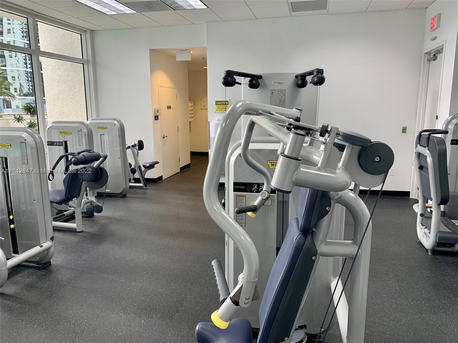 1200 Brickell Bay Drive, Unit 1812 Miami, FL 33131 - Photo 19 of 24 a view of a room with gym equipment