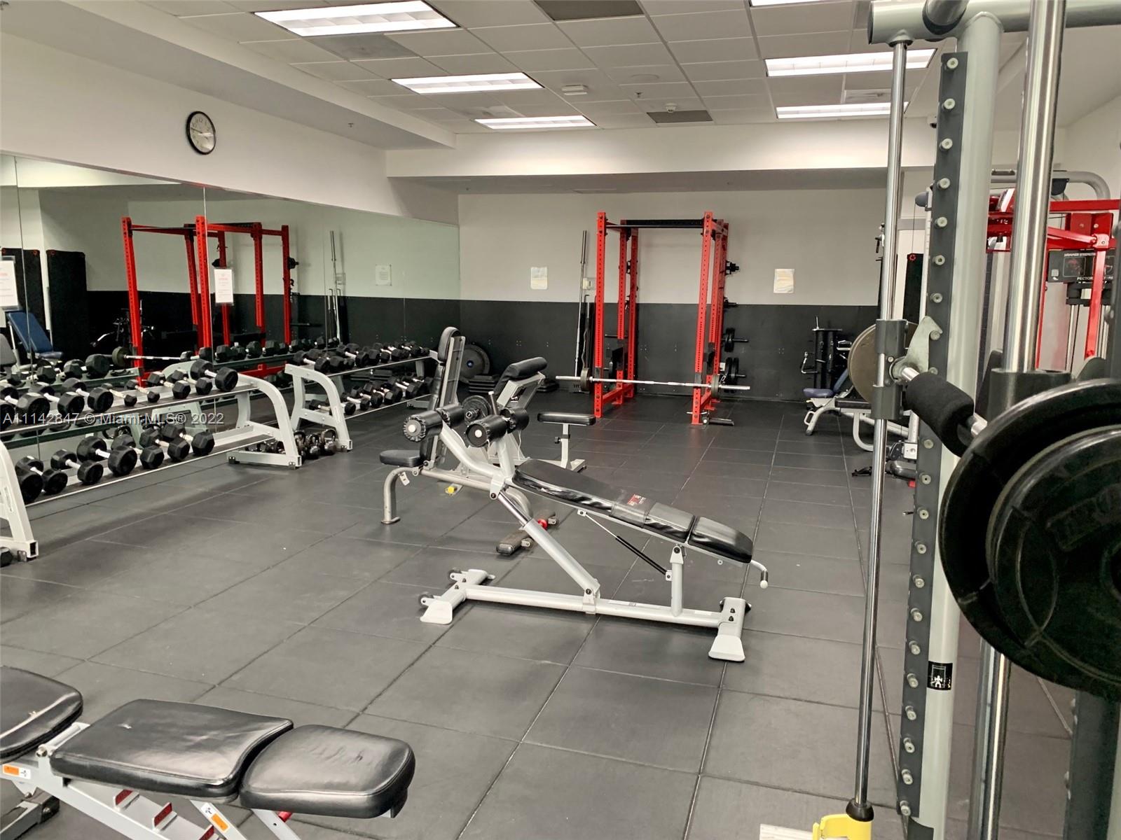 1200 Brickell Bay Drive, Unit 1812 Miami, FL 33131 - Photo 20 of 24 a view of a room with gym equipment