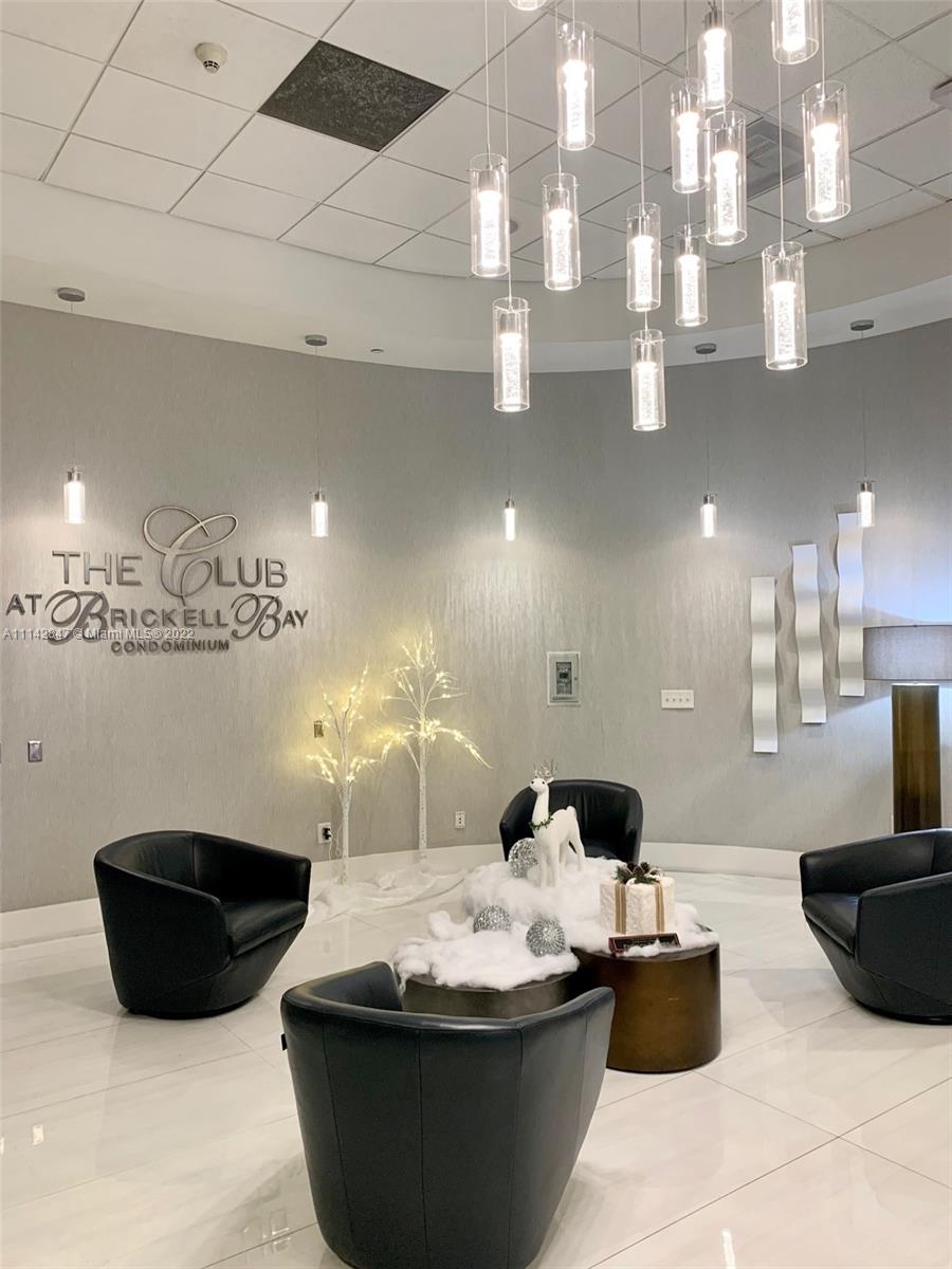 1200 Brickell Bay Drive, Unit 1812 Miami, FL 33131 - Photo 22 of 24 a large room with lots of potted plants