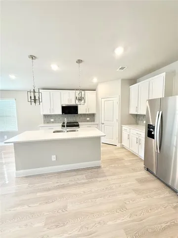 a view of a kitchen with a sink