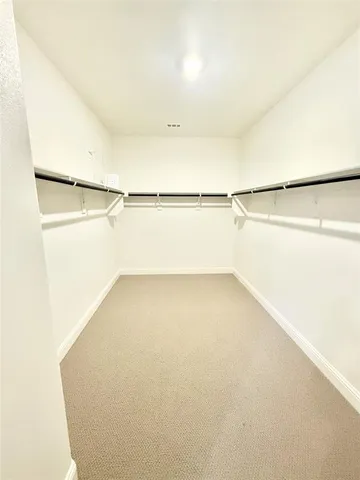 a kitchen that has a sink a counter space and cabinets