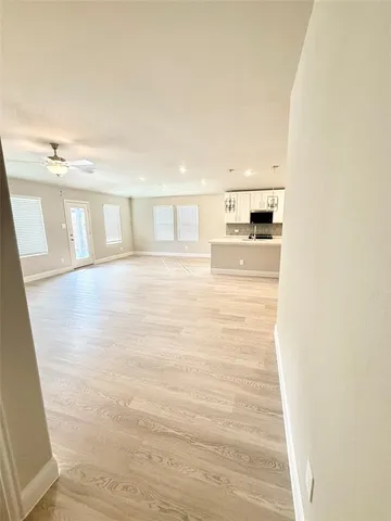 a spacious bathroom with a double vanity sink and a mirror