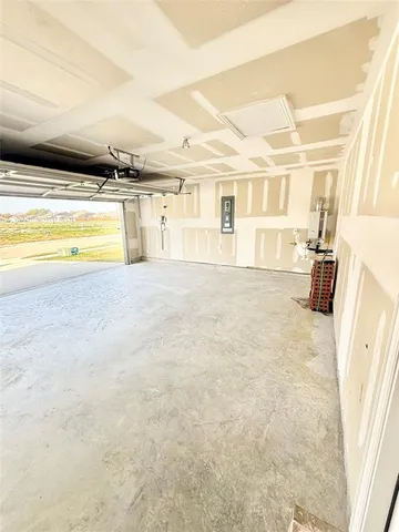 a view of a living room with kitchen