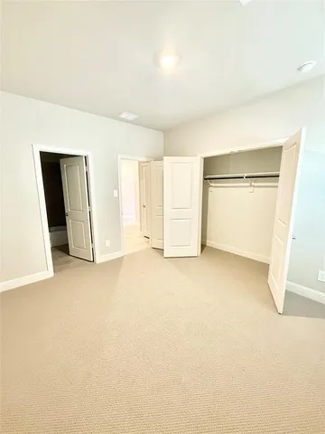 an empty room with a empty space and windows