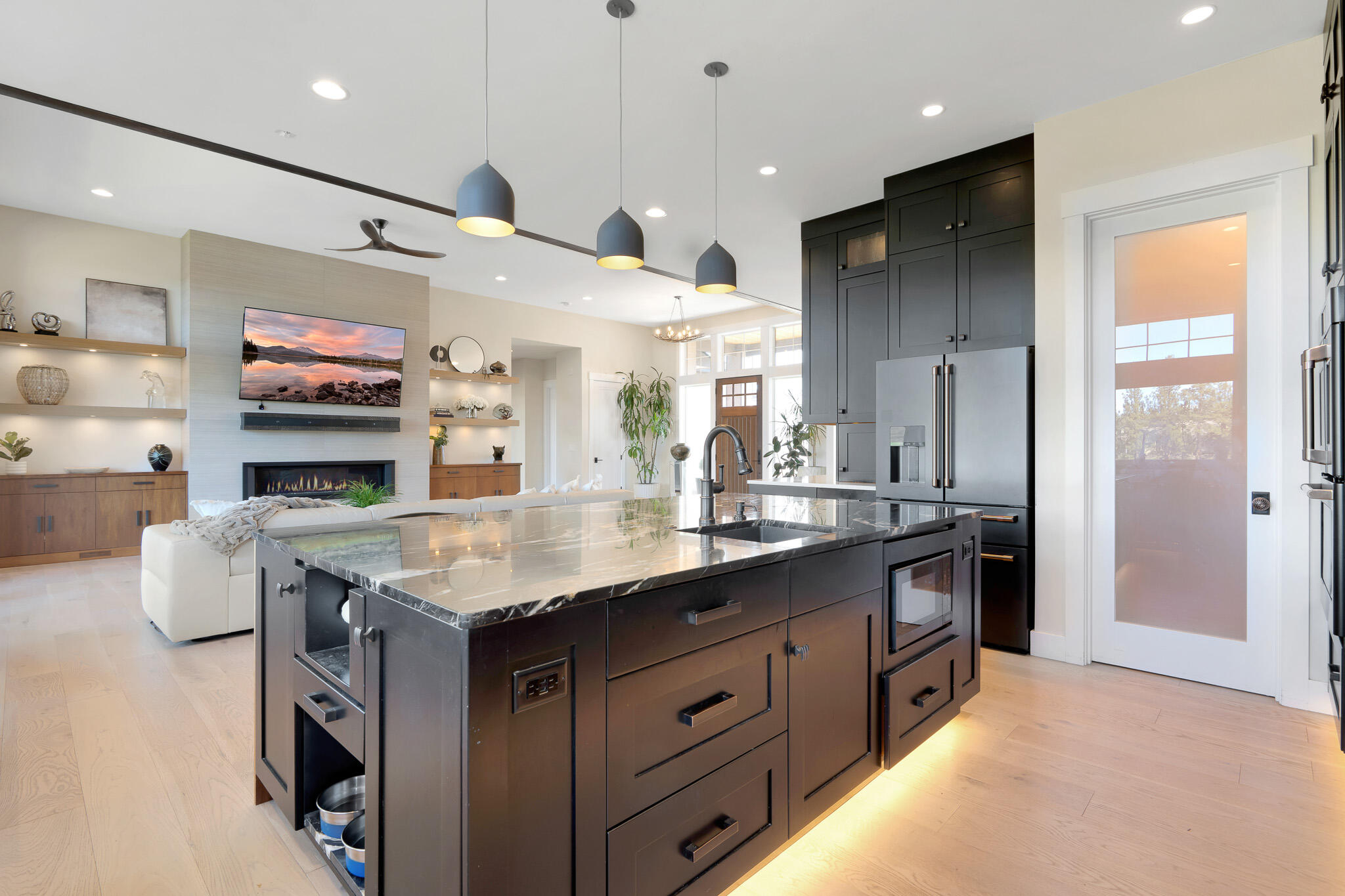60871 River Rim Drive Bend, OR 97702 - Photo 15 of 42 a kitchen with stainless steel appliances granite countertop a stove a sink and a refrigerator