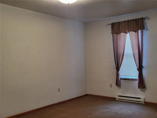 a view of front door with wooden floor