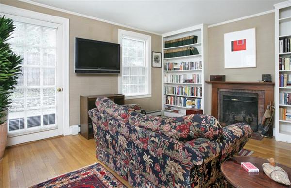 21 Fairmount Street Brookline, MA 02445 - Photo 5 of 10 a living room with furniture a flat screen tv and a fireplace