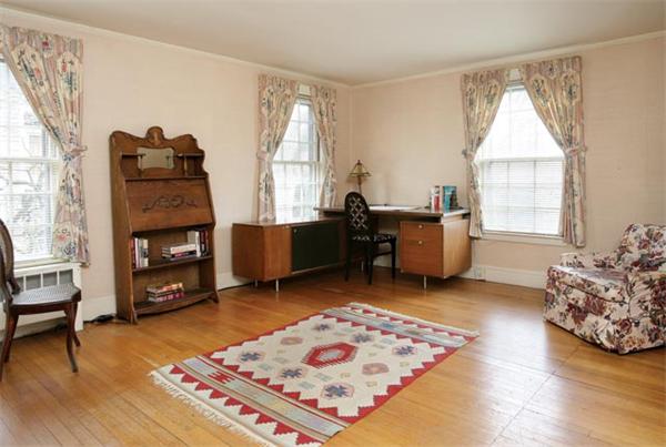 21 Fairmount Street Brookline, MA 02445 - Photo 8 of 10 a living room with furniture and a fireplace