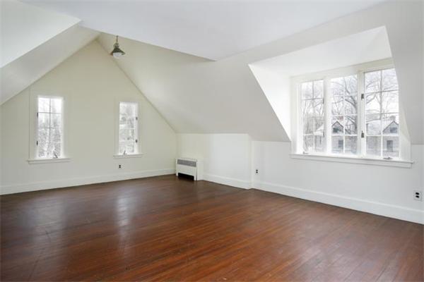 21 Fairmount Street Brookline, MA 02445 - Photo 9 of 10 an empty room with wooden floor and windows