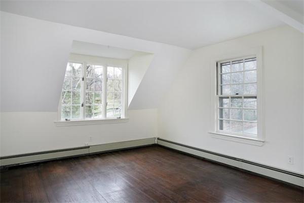 21 Fairmount Street Brookline, MA 02445 - Photo 10 of 10 an empty room with wooden floor and windows