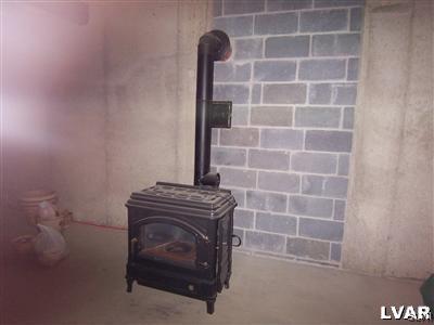 8756 South Loop Road Slatington, PA 18080 - Photo 23 of 25 OIL STOVE IN UNFINISHED BSMT, 9' BSMT CEILINGS, OU