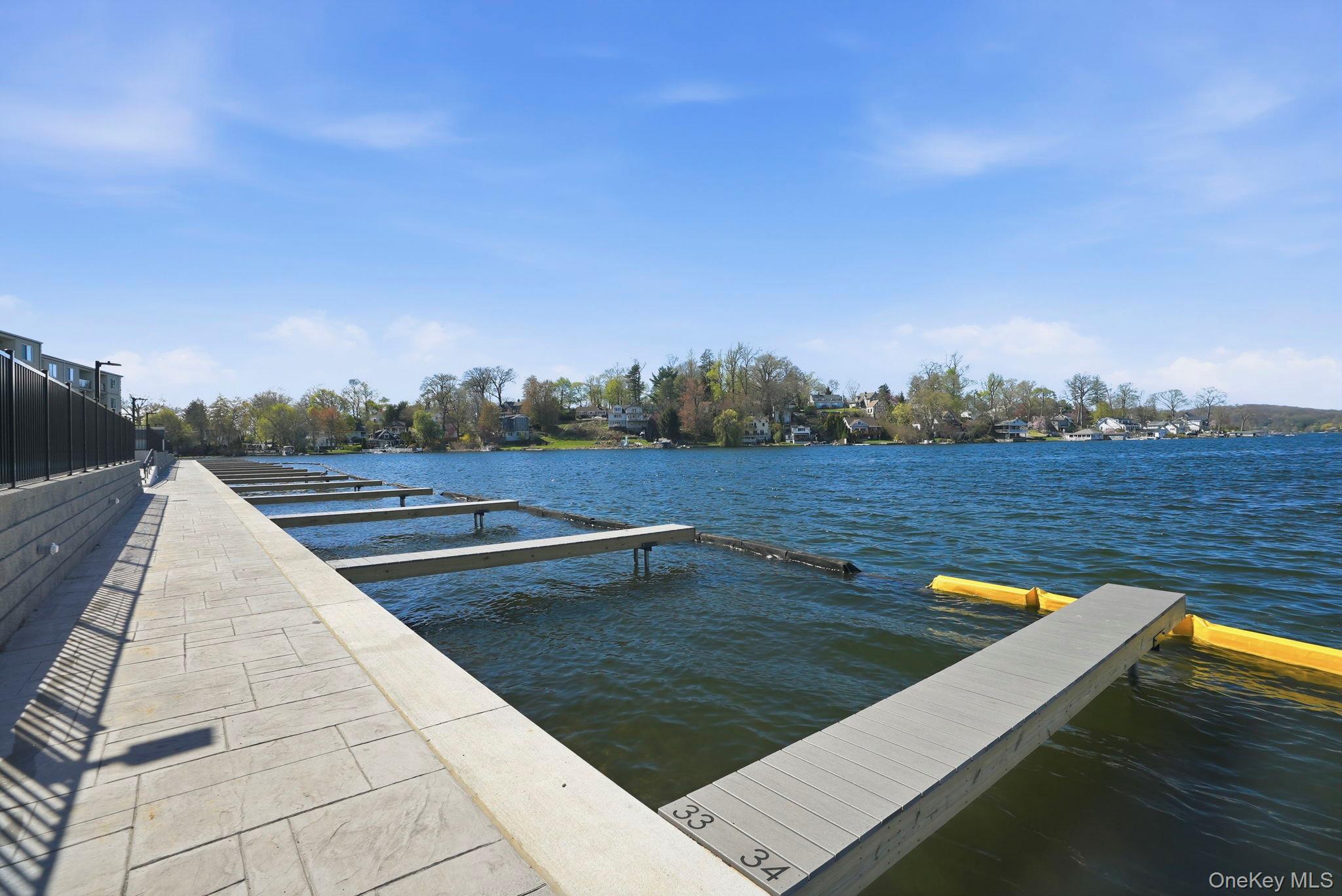 4 Marina Drive, Unit D2 Mahopac, NY 10541 - Photo 30 of 39 The property features a private dock with individual boat slips and direct access to the lake