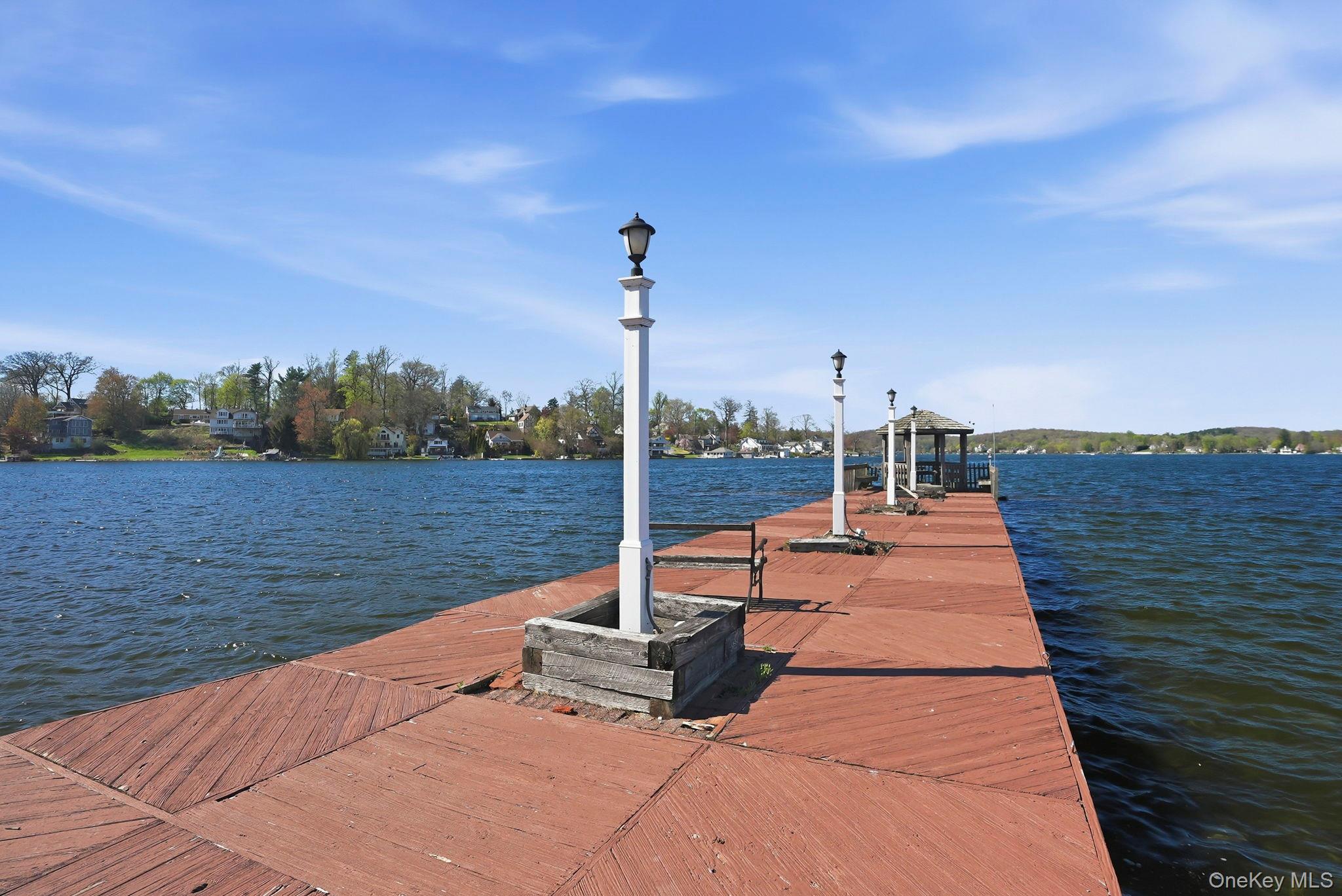 4 Marina Drive, Unit D2 Mahopac, NY 10541 - Photo 31 of 39 Private dock extending into a body of water, featuring multiple lamp posts and a gazebo structure