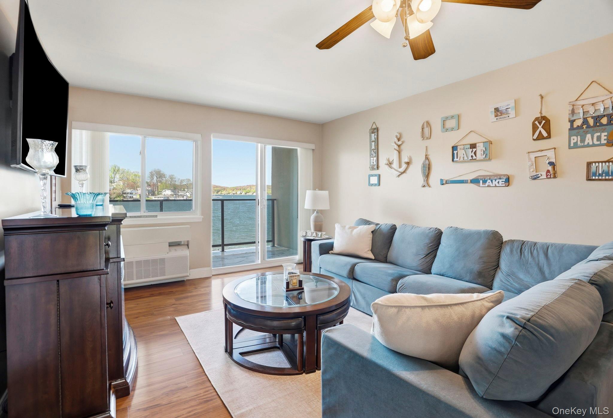 4 Marina Drive, Unit D2 Mahopac, NY 10541 - Photo 8 of 39 This inviting living space features hardwood floors and a ceiling fan