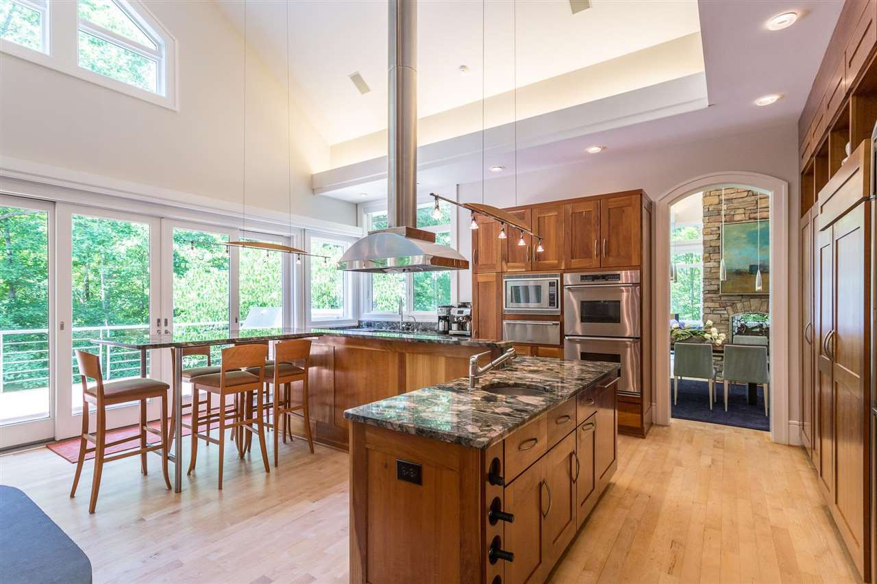 1117 Baslow Brook Court Raleigh, NC 27614 - Photo 14 of 30 Dacor® SS appliances include a microwave, warming drawer, double convection ovens and 6-burner gas cooktop w/griddle. A 48” wide Sub-Zero® refrigerator/freezer, a suspended Abbaka SS range hood, and KitchenAid Dishwasher completed the suite of appliances. Upscale Kitchen Appliances