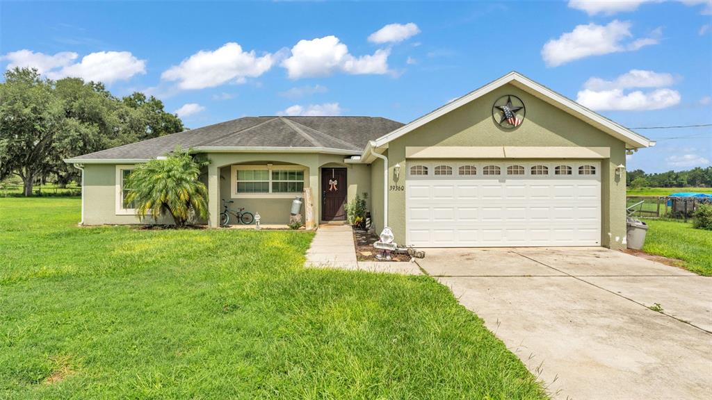 39360 Sparkman Road Dade City, FL 33525 - Photo 1 of 40 a view of a house with a yard