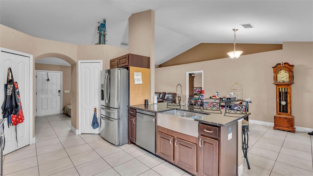 39360 Sparkman Road Dade City, FL 33525 - Photo 12 of 40 a kitchen with a sink and refrigerator