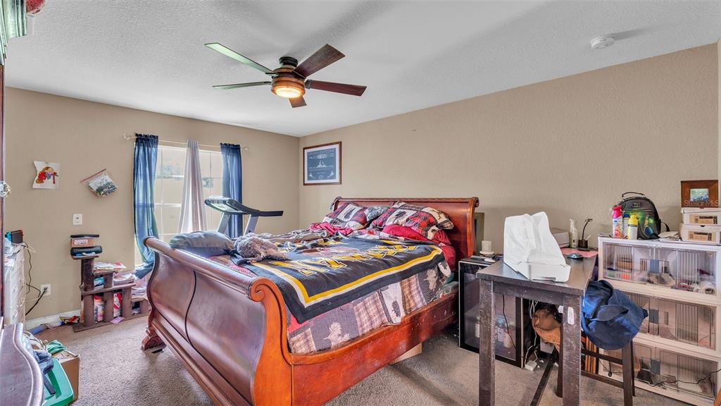 39360 Sparkman Road Dade City, FL 33525 - Photo 19 of 40 a bed room with furniture and a window