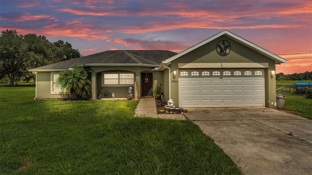 39360 Sparkman Road Dade City, FL 33525 - Photo 2 of 40 a front view of a house with a yard